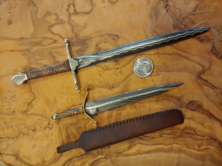 set of miniature daggers with dime for comparison