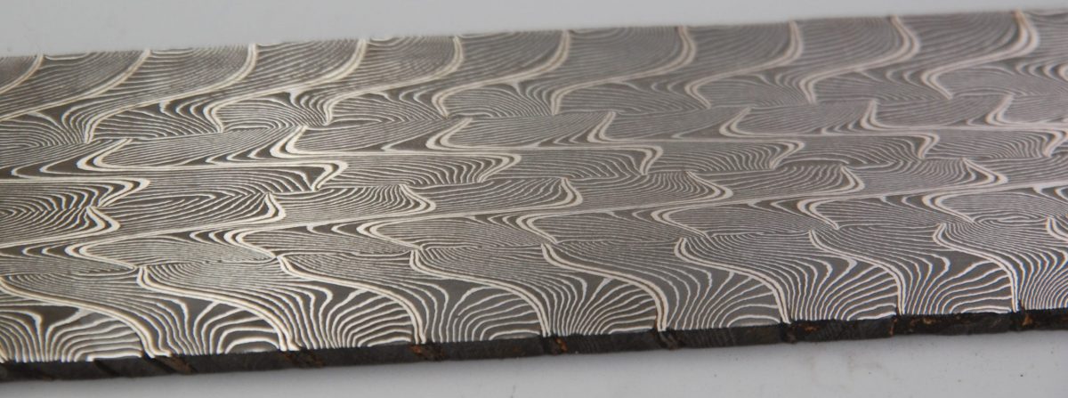 closeup of damascus steel billet with unique patterns