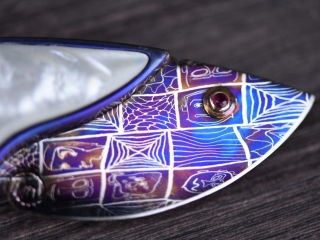 closeup of the patterns in the purple and blue damascus