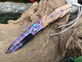 pretty purple damascus knife with wood handle