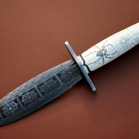 spider themed dagger custom made with damascus web patterns