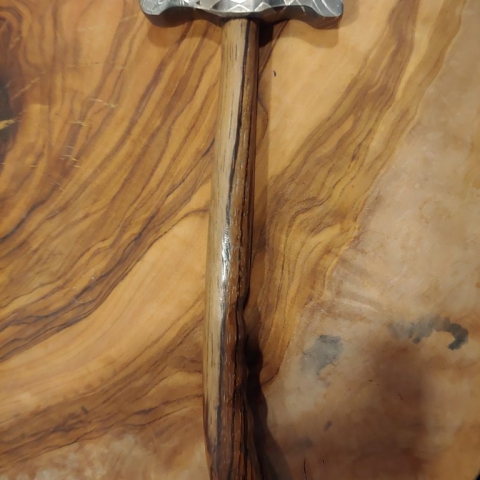 head of a hammer made with damascus steel