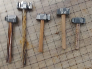 several hammers of different sizes made with different billets of steel