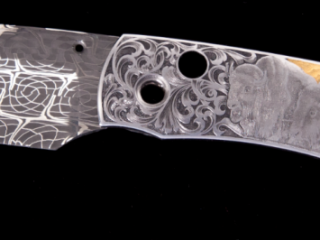 knife with a buffalo handle and a damascus pattern reminicent of dreamcatchers