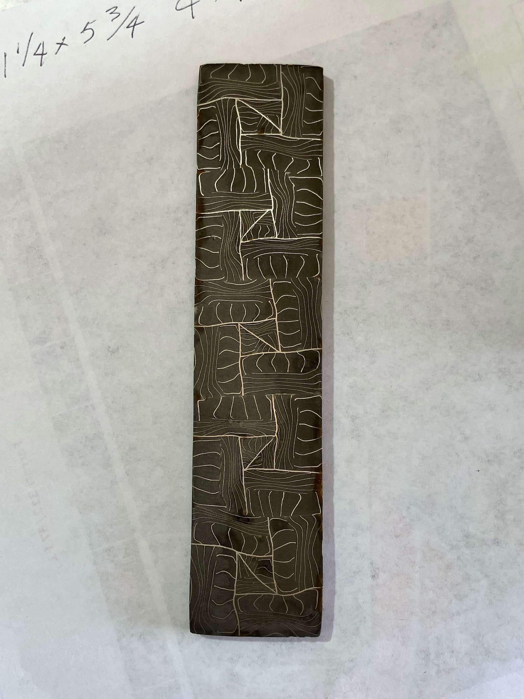 damascus billet with an alternating pattern similar to the grooves on a pumpkin